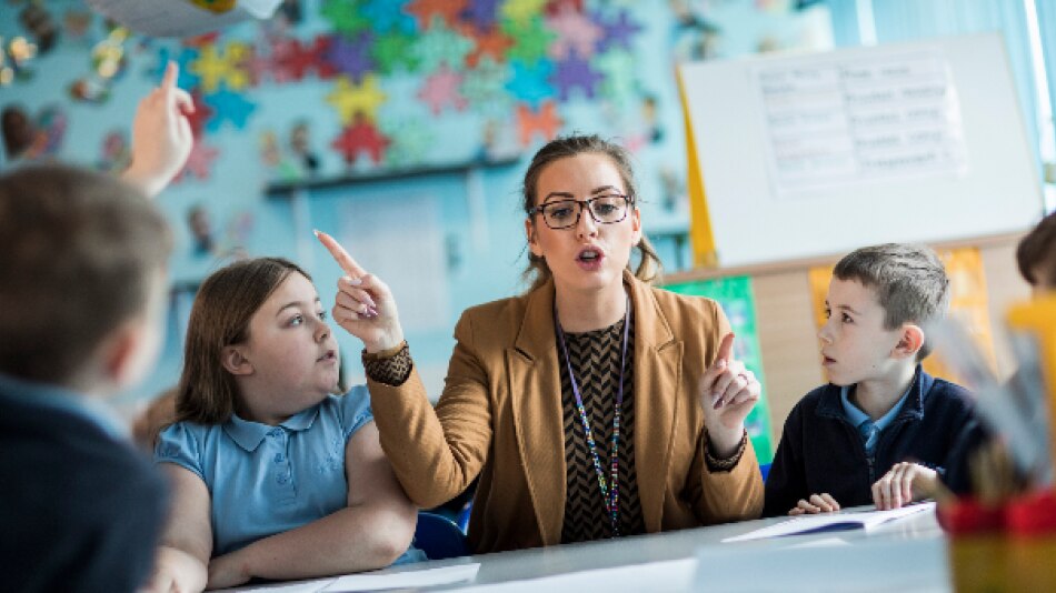 Teacher teaching primary class