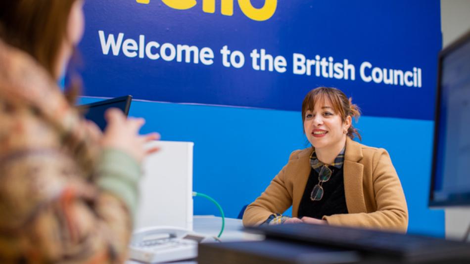 Person sat at a desk providing customer service support