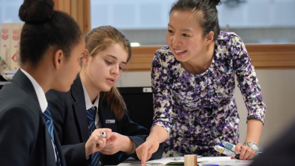 A teacher works on Mandarin Chinese with pupils. Image (c) Philip Meech Photography
