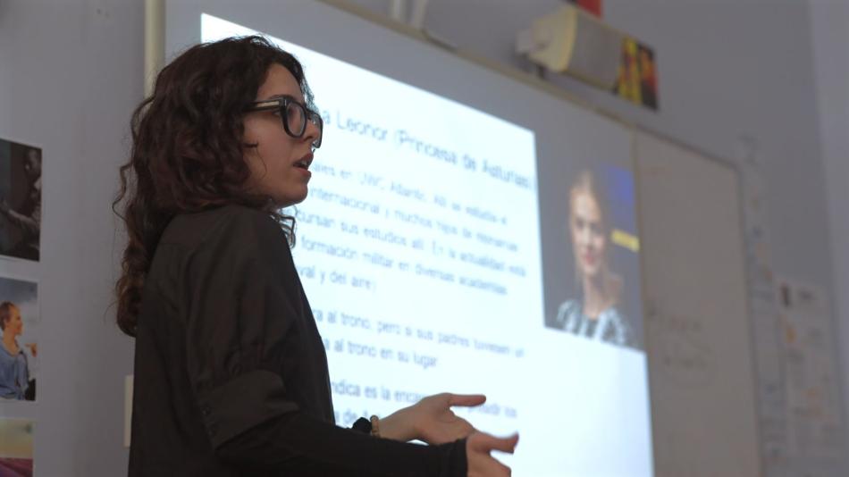 A Spanish language assistant presents to a class about her culture