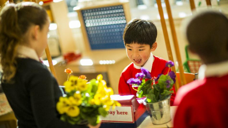 Children playing shop while learning languages