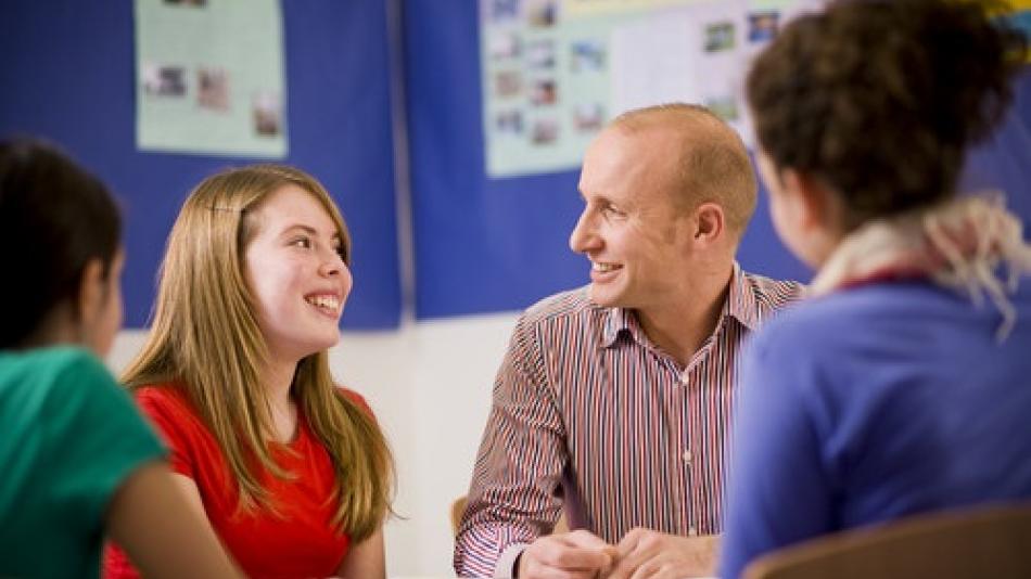Language teacher in classroom with pupils