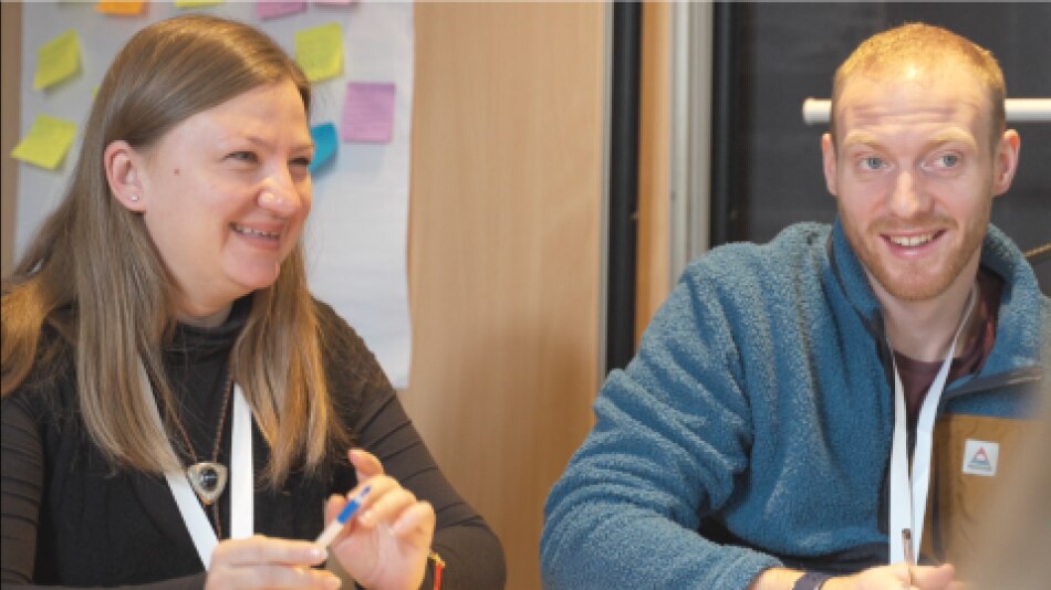 Two people in a discussion