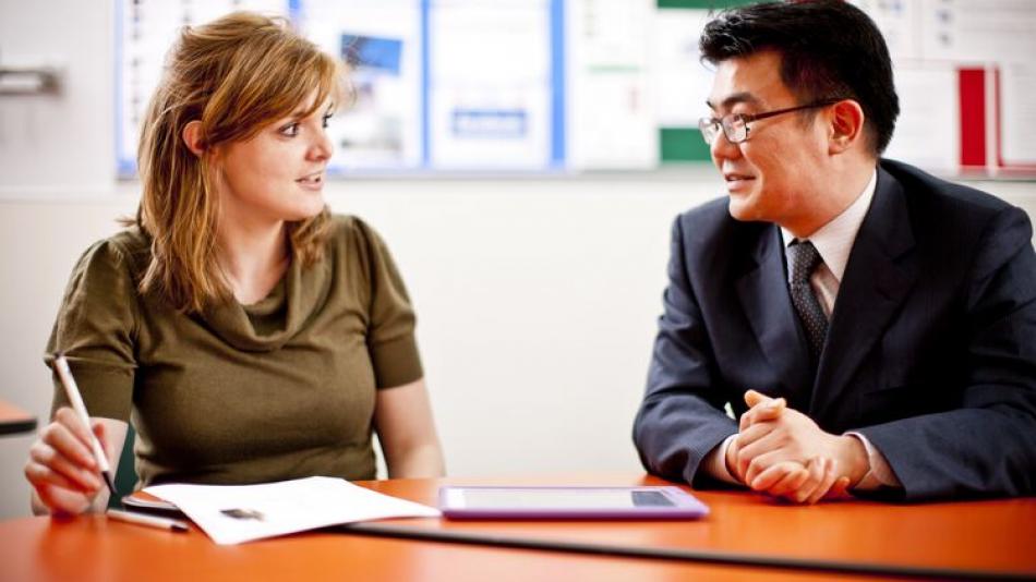 a man and a woman in conversation